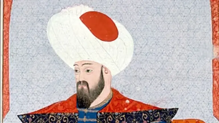 Osman I in an Ottoman miniature: a bearded man in a tall white turban with a red patch, a red collar over a dark patterned coat, against a pale blue tiled background