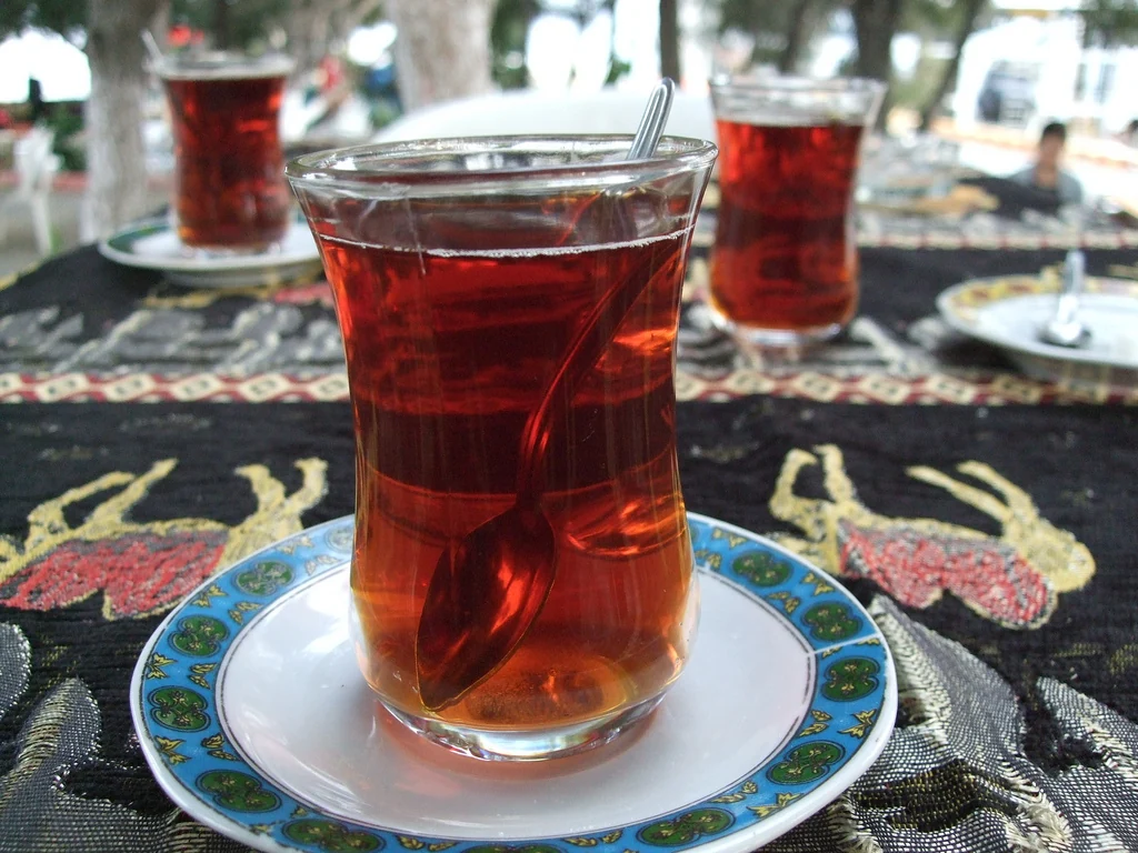 Turkish tea in tulip-shaped glasses on saucers