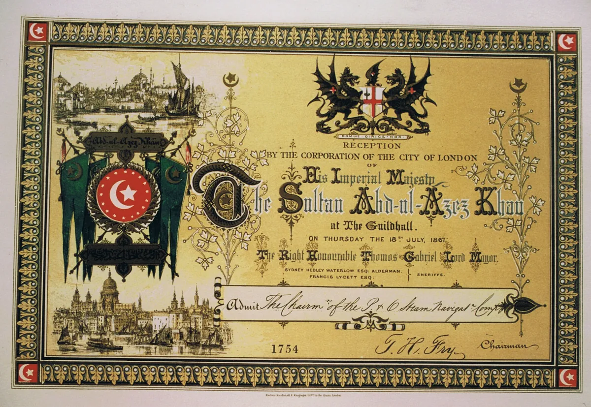 An ornate gold and green printed ticket with a coat of arms, headed with the sultan’s name, for a reception at the Guildhall on Thursday 18 July 1867