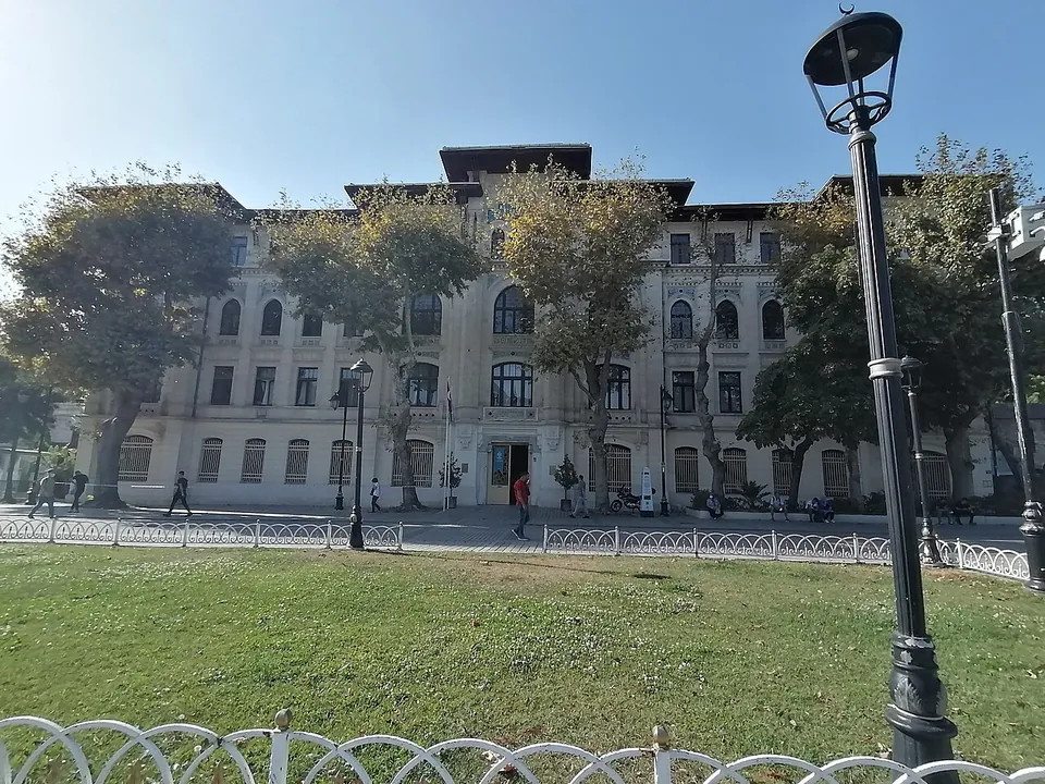 The Istanbul regional directorate of the land registry, a large old stone building seen across a lawn with plane trees