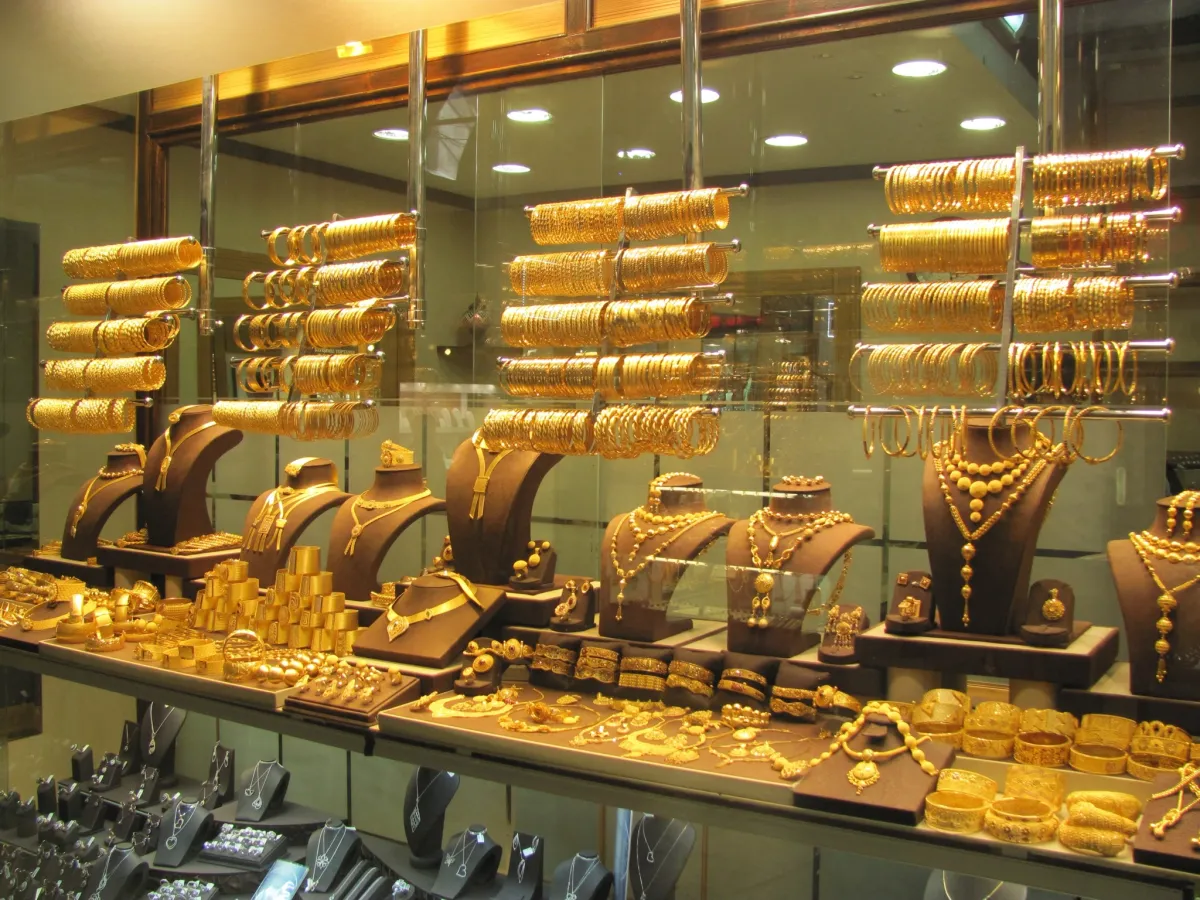 A jeweller's window full of gold bangles, necklaces and rings on brown busts, Grand Bazaar, Istanbul